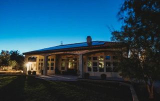 House with solar panels at dusk