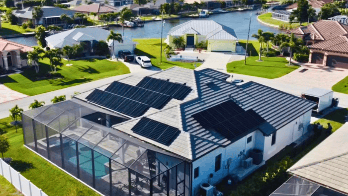 Panoramic view of George Laufer’s solar-powered residence, highlighting the extensive array of 38 Sunpower panels in Cape Coral