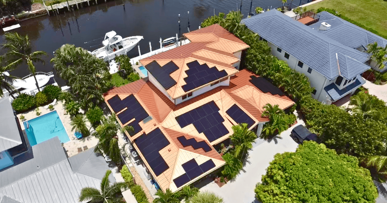 Aerial view of a home with solar panels installed by Castaways Energy, showcasing efficient solar energy solutions.