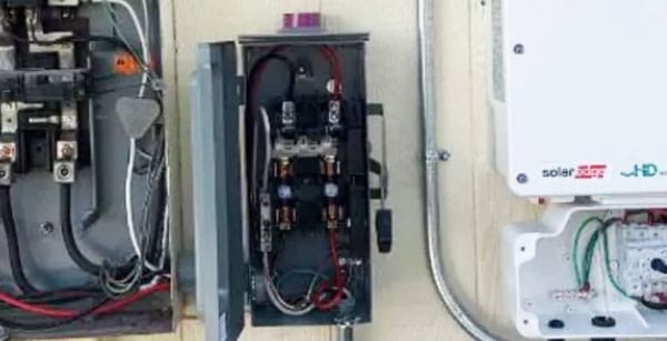 Solar panel electrical components and wiring setup, highlighting the technical details of solar energy system installation.