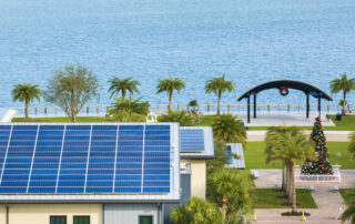 Castaways Energy solar panels on a Florida building near the waterfront, illustrating how net metering and utility policies impact solar savings