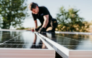 Castaways Energy technician performing solar panel repair and maintenance service on a residential solar energy system in Florida