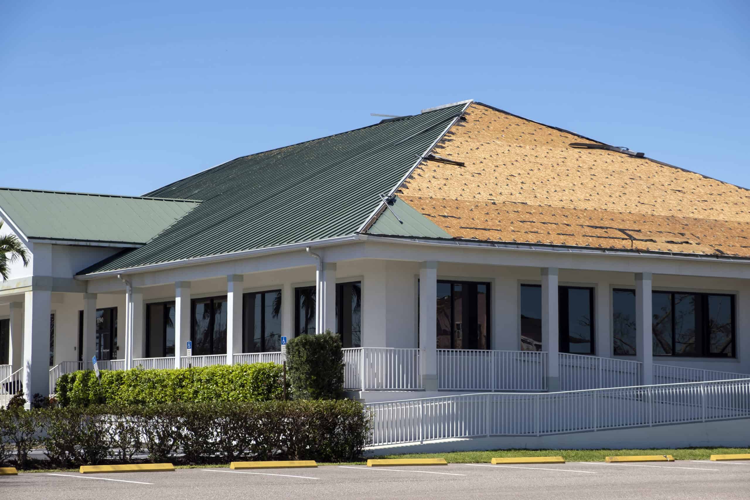 Castaways Roofing commercial roof replacement in progress on a Central Florida business property. Castaways Roofing commercial roof replacement in progress on a Central Florida business property.